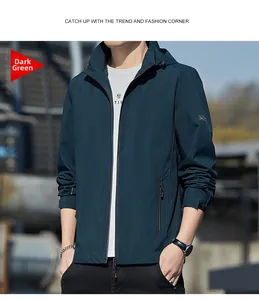 Detail of dark green hooded jacket with functional zipper pockets and durable outdoor fabric