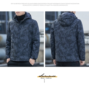 Detail of waterproof camouflage jacket with honeycomb texture and windproof hood