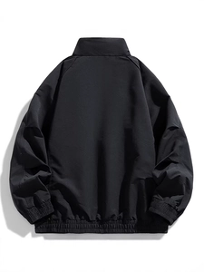Men's minimalist black stand collar jacket with raglan sleeves and a relaxed fit back view