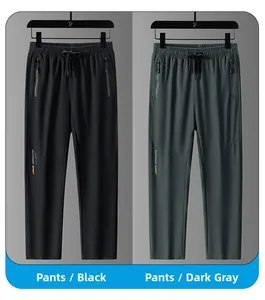 Dettaglio dei pantaloni sportivi outdoor con tasche a zip e vita con coulisse regolabile