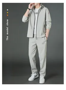 Detailed close-up of light gray men's sport jacket with diamond-shaped sleeve patch