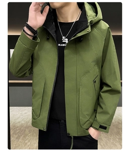 Detail of army green cargo jacket featuring raglan sleeves and large functional pockets