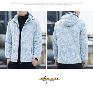 Detail of light blue camouflage outdoor waterproof jacket with hood and warm fleece lining
