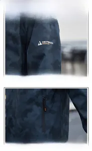 Détail de la veste d'extérieur avec poche zippée étanche et imprimé graphique sur la manche