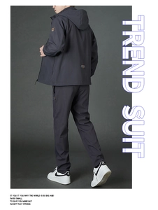 Detail of dark grey hooded tracksuit with windproof fabric and trendy back print