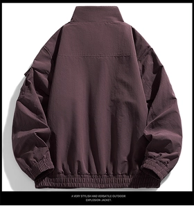 Back view of dark purple windproof outdoor jacket with elastic cuffs and hem