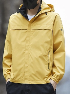 Waterproof yellow outdoor hooded jacket with windproof fabric and sporty raglan sleeves
