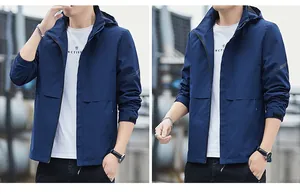 Detail of the dark blue hooded jacket featuring adjustable velcro cuffs and sport sleeve logo