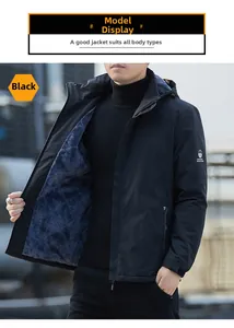 Detail of men's black hooded jacket with thick grey fleece lining and velcro cuffs