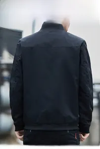 Back view of a black men's bomber jacket with a stand collar and ribbed hem