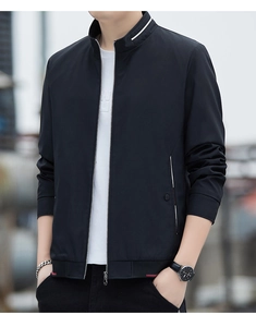 Close-up of black standing collar jacket with white trim and red accent details