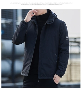 Detail of windproof men's jacket with sleeve logo patch and elastic cuffs