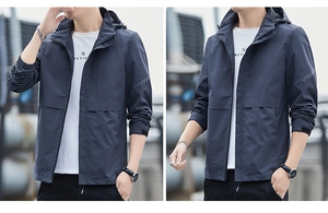 Detail view of navy blue windproof jacket featuring chest pocket and velcro cuffs