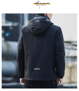 Detail of winter jacket with thick gray fleece lining and windproof black fabric