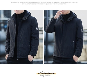 Detail of a black hooded winter jacket featuring a brand logo and velcro adjustable cuffs