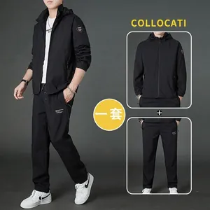 Men's casual black hooded sport jacket and jogger set with zipper and drawstring detail