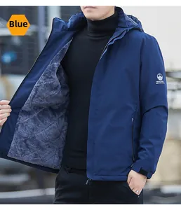 Close-up of blue hooded outdoor jacket with warm grey fleece lining and velcro cuffs