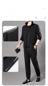 Detail of men's black tracksuit featuring side grey stripes and stand collar zipper jacket