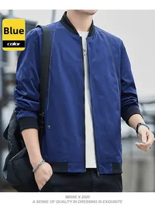 Detail of blue baseball collar jacket with black ribbed cuffs and MENIN CLAN embroidery