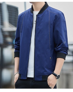 Detail of dark blue men's bomber jacket with ribbed collar and MENIN CLAW sleeve print
