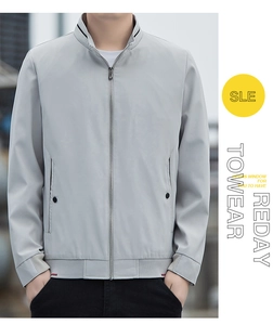 Close-up of a men's light grey standing collar jacket featuring ribbed cuffs and side pockets