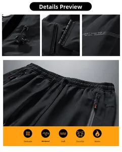 Detail view of black windproof outdoor pants with sealed zipper and elastic drawstring waist