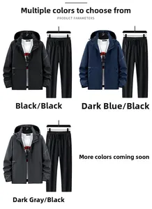 Flat lay of three men's outdoor hooded tracksuits in black, dark blue and grey colors