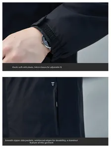 Detail of adjustable velcro cuffs and side zipper pockets on black functional jacket