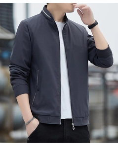 Detail of men's casual jacket featuring stand collar with white stripes and ribbed cuffs