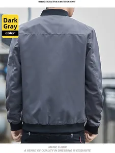 Rear view of a men's dark grey stand collar bomber jacket with black ribbed trim detail