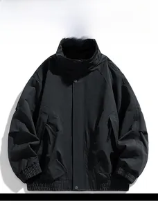 Close-up of windproof black outdoor jacket featuring stand collar and metal snap buttons