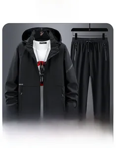 Detail view of black outdoor windbreaker set with adjustable velcro cuffs and zip pockets