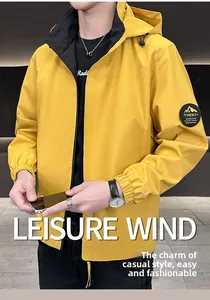Detail of trendy ginger hooded jacket showing arm patch and high-quality windproof fabric