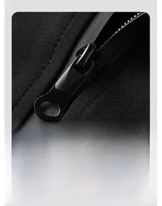 Macro view of a smooth black metal zipper and knit fabric texture on a jacket