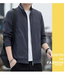 Close-up of a men's dark grey jacket featuring a stand-up collar and premium metal zipper
