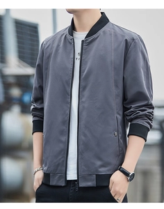 Detailed view of dark grey jacket with contrasting ribbed collar and metallic zipper