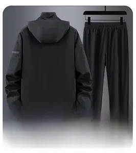 Rear view of black waterproof outdoor hiking jacket set with reflective safety stripes