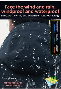 Detail of waterproof dark blue outdoor jacket showing raindrops on functional fabric