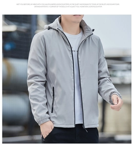 Detail of light gray hooded jacket featuring elastic cuffs and zipper pocket with NEW logo