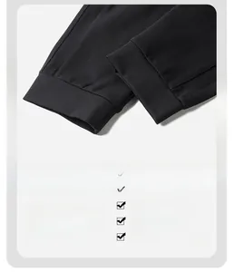 Detail view of elastic cuffed hem on black athletic pants with premium 3D tailoring
