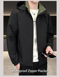 Detail of hooded windbreaker with contrast green lining and windproof zipper closure