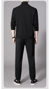 Rear view of black men's sports tracksuit with stand collar jacket and jogger pants