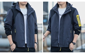 Close-up of windproof jacket with contrast yellow zippers and tactical arm pocket detail