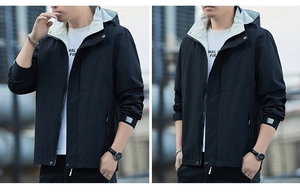 Detail of men's black hooded jacket featuring contrast lining and adjustable velcro cuffs