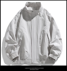Detail view of the standing collar and hidden snap placket on this casual men's jacket