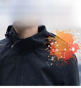 Close-up of black hooded jacket with subtle palm leaf texture and stain-resistant fabric