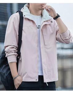 Detail of light pink men's hooded jacket with color-block lining and zip-up pocket