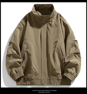 Detail of khaki outdoor jacket featuring a windproof stand collar and heavy texture fabric