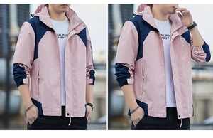 Detail of pink and navy hooded windbreaker showing color blocking and cuff strap