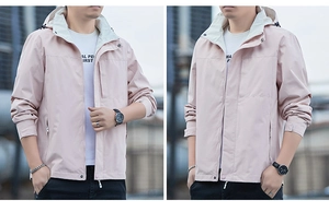 Detail of light pink men's hooded jacket with contrast lining and chest zipper pocket